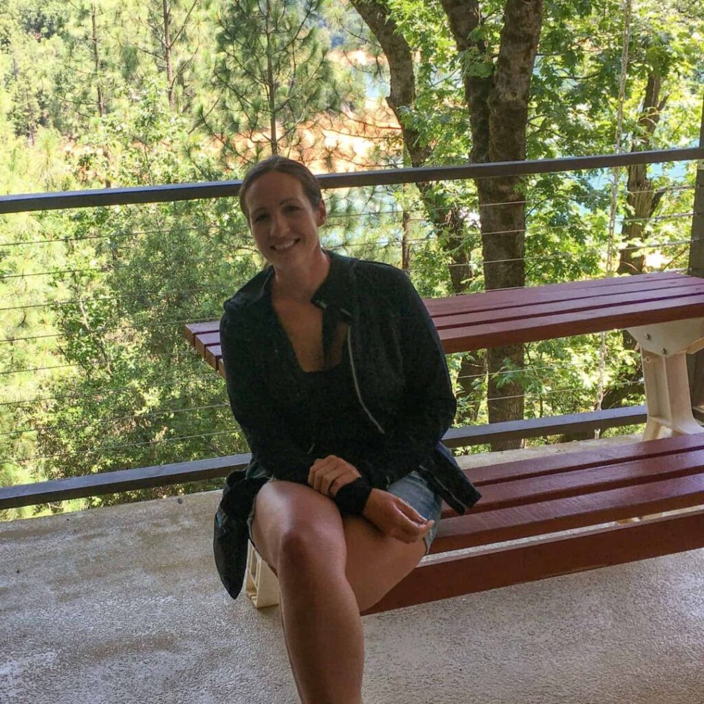 Amber sitting on bench at Shasta Caverns. 